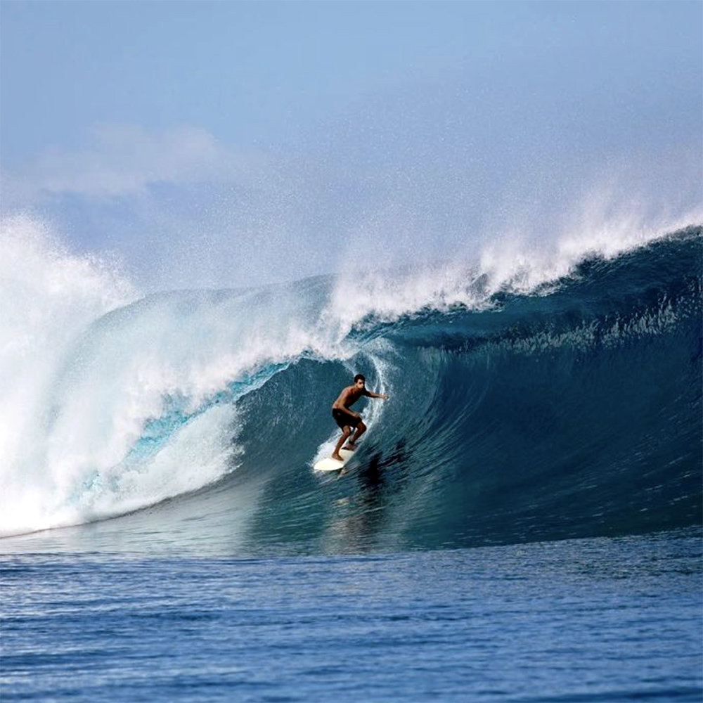 Surfing a big wave at Cloudbreak